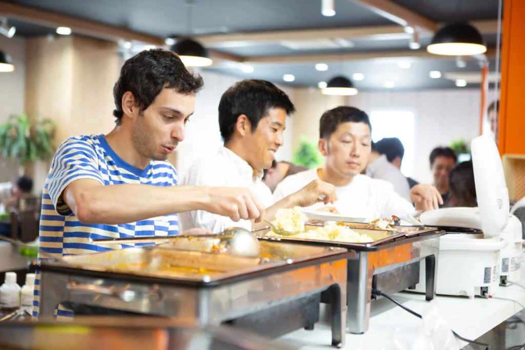 Global team members sharing lunch